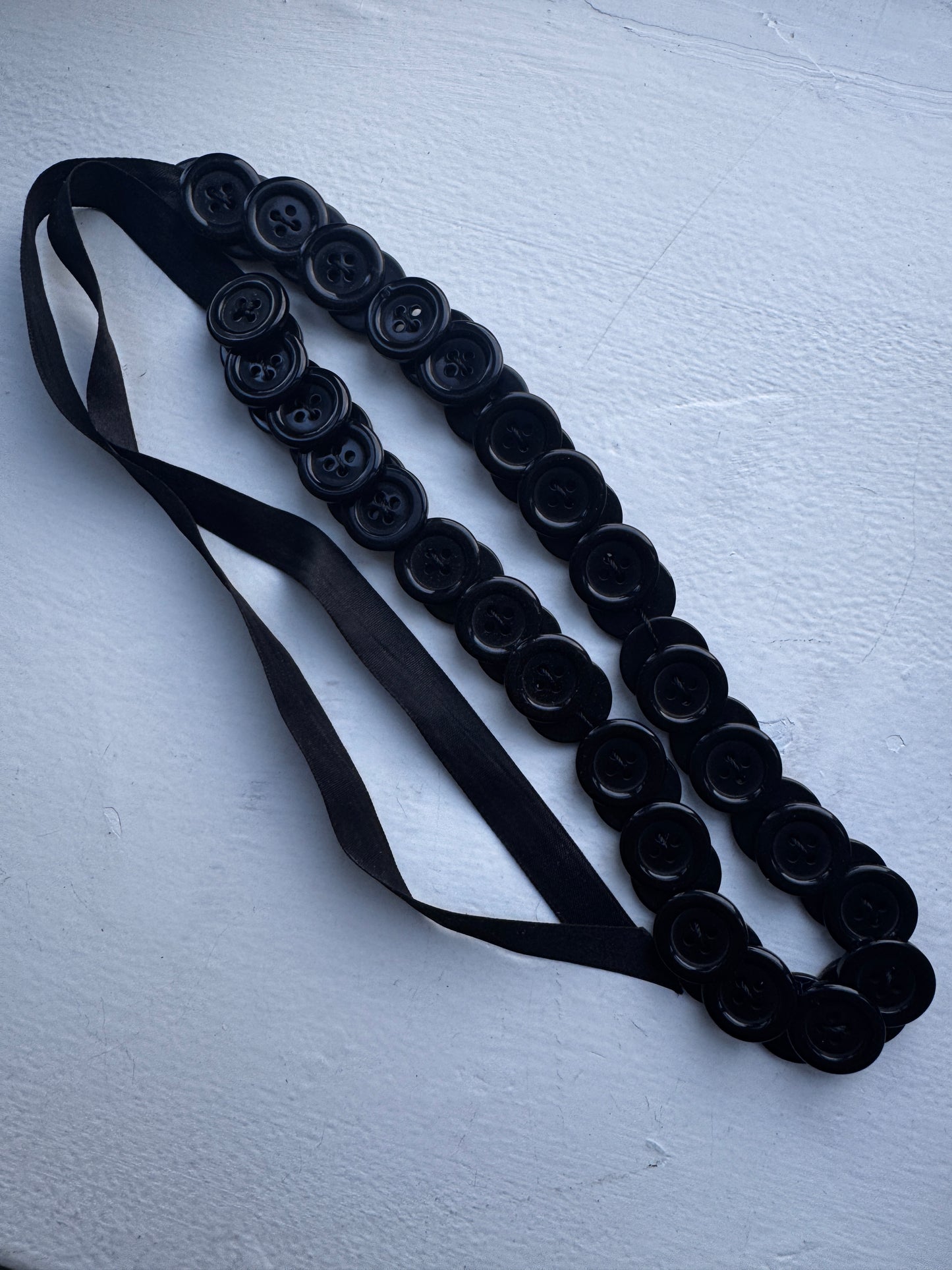 button necklace / tied accessory