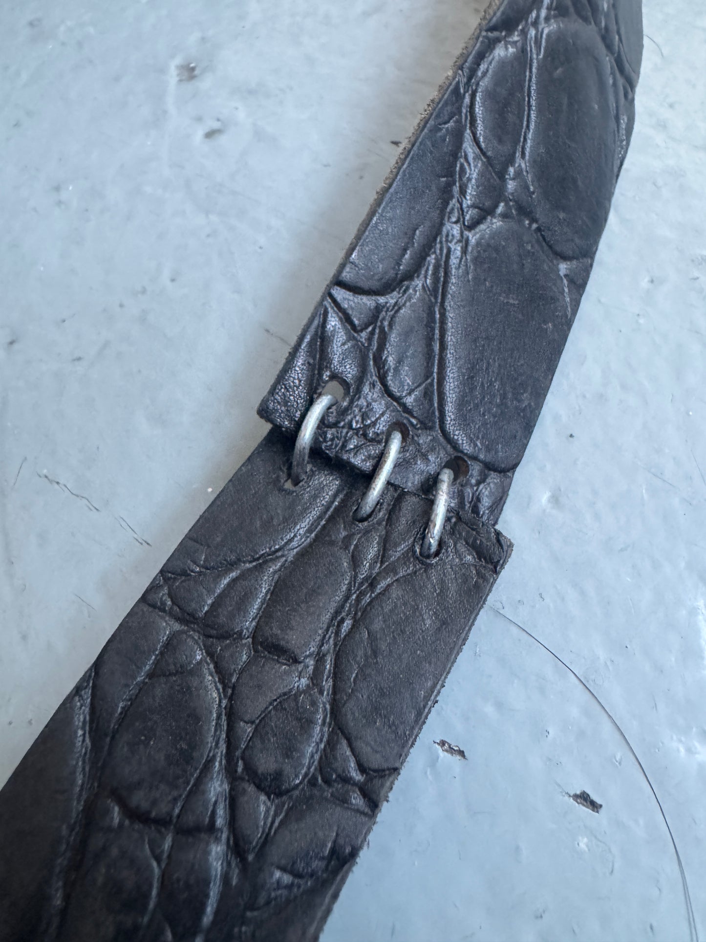objet pierced crocodile effect leather belt