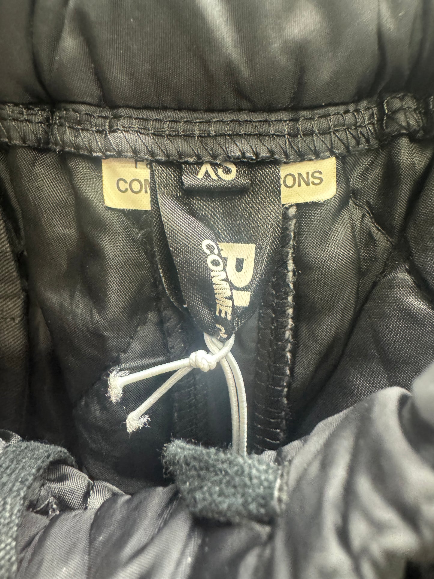 comme des garçons black padded nylon shorts