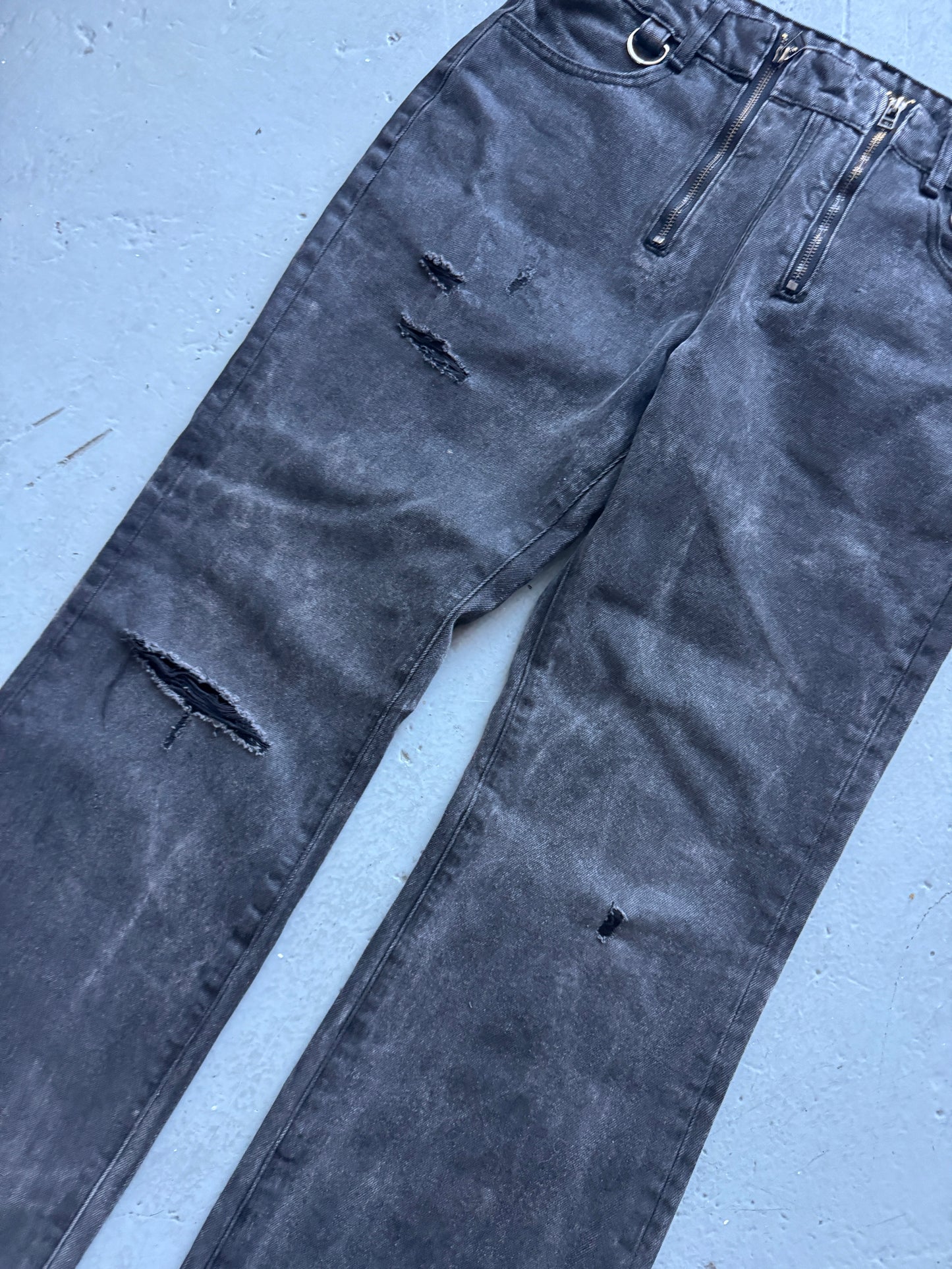 troubled waters zip waist distressed denim