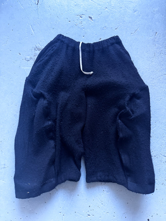comme des garcons sructured boiled wool shorts