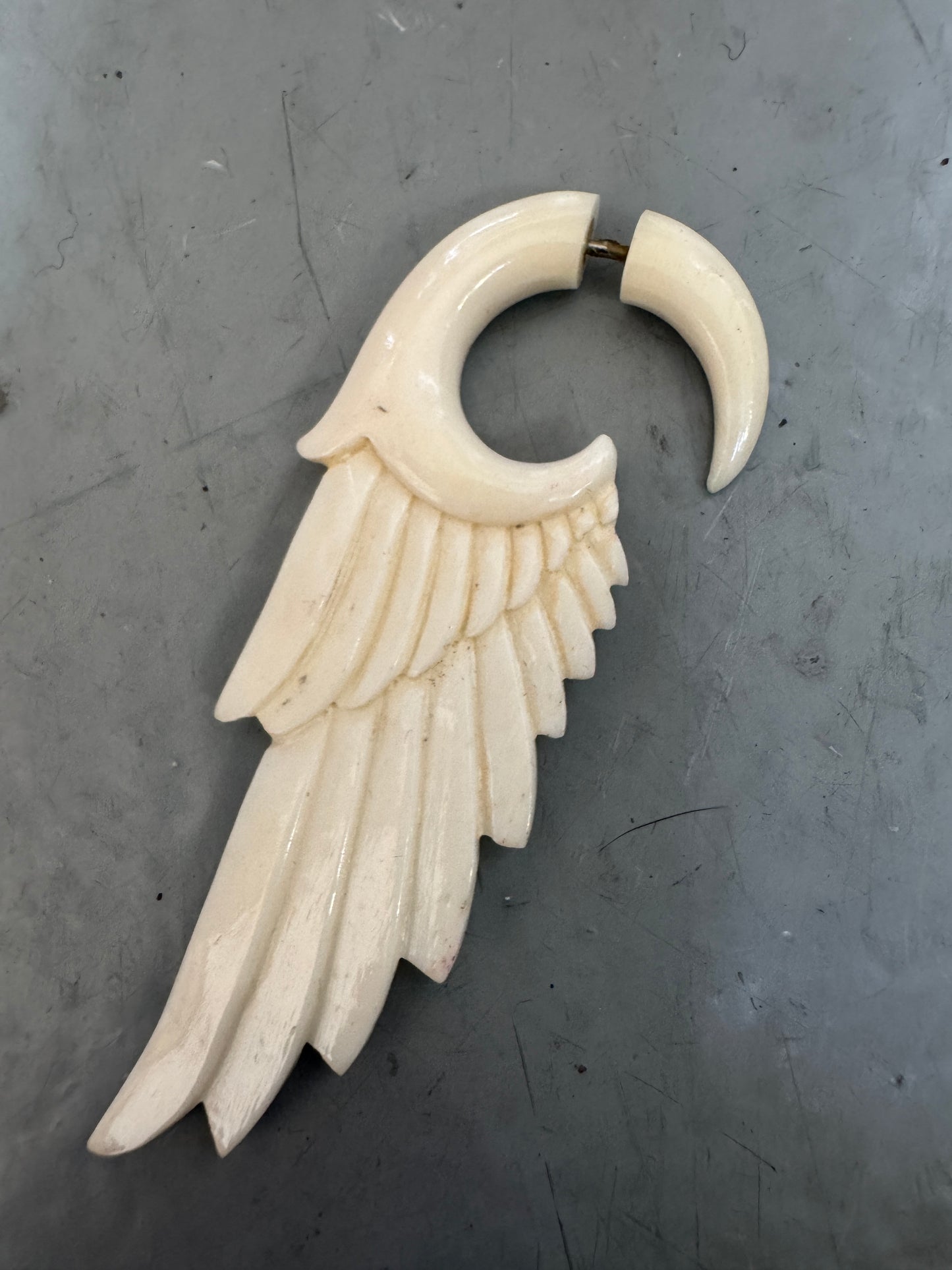 vintage carved angel wing earring