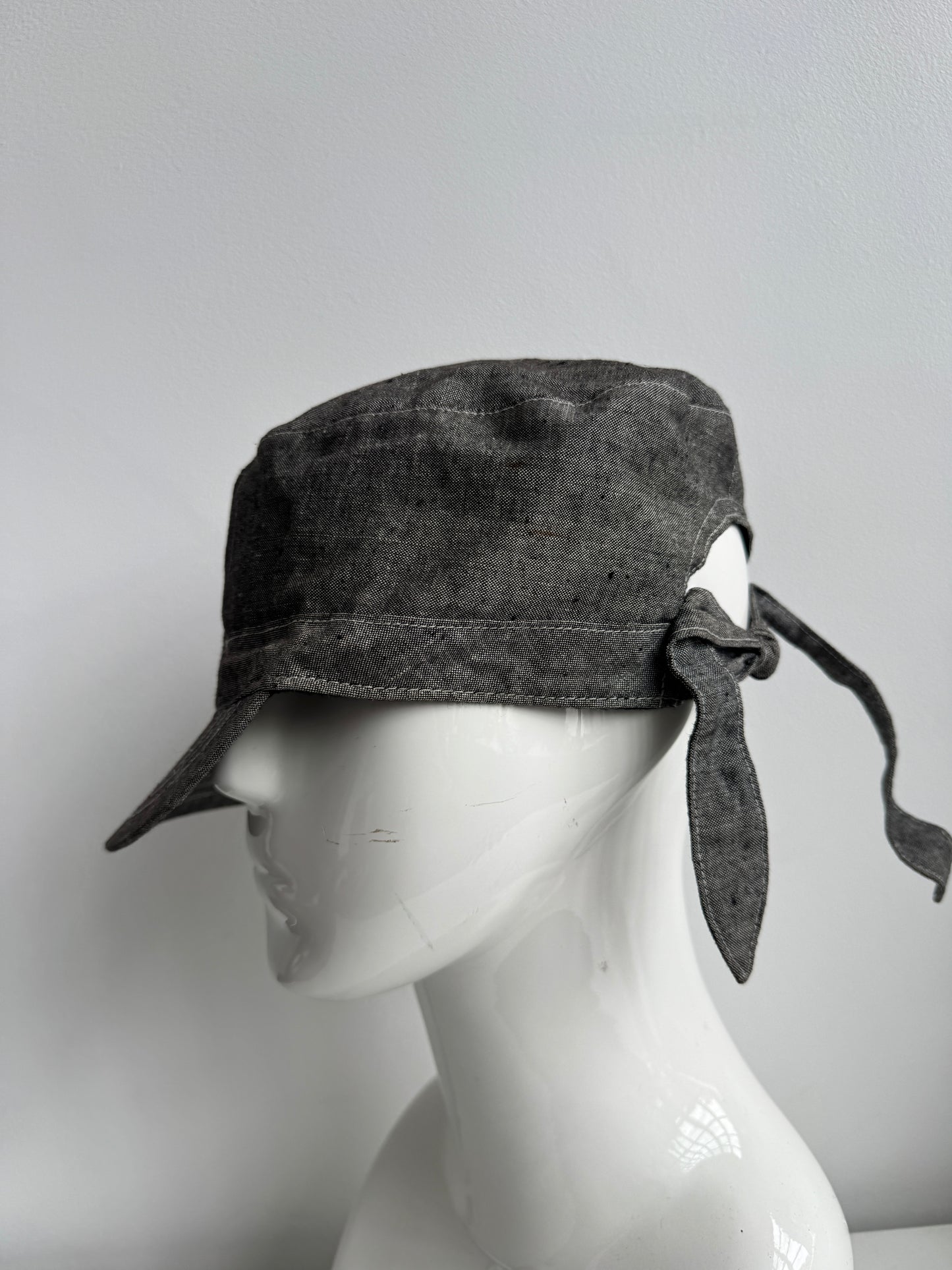 tied back hat