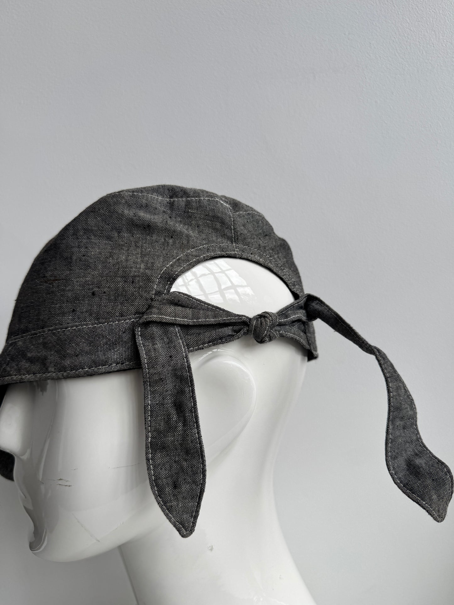 tied back hat