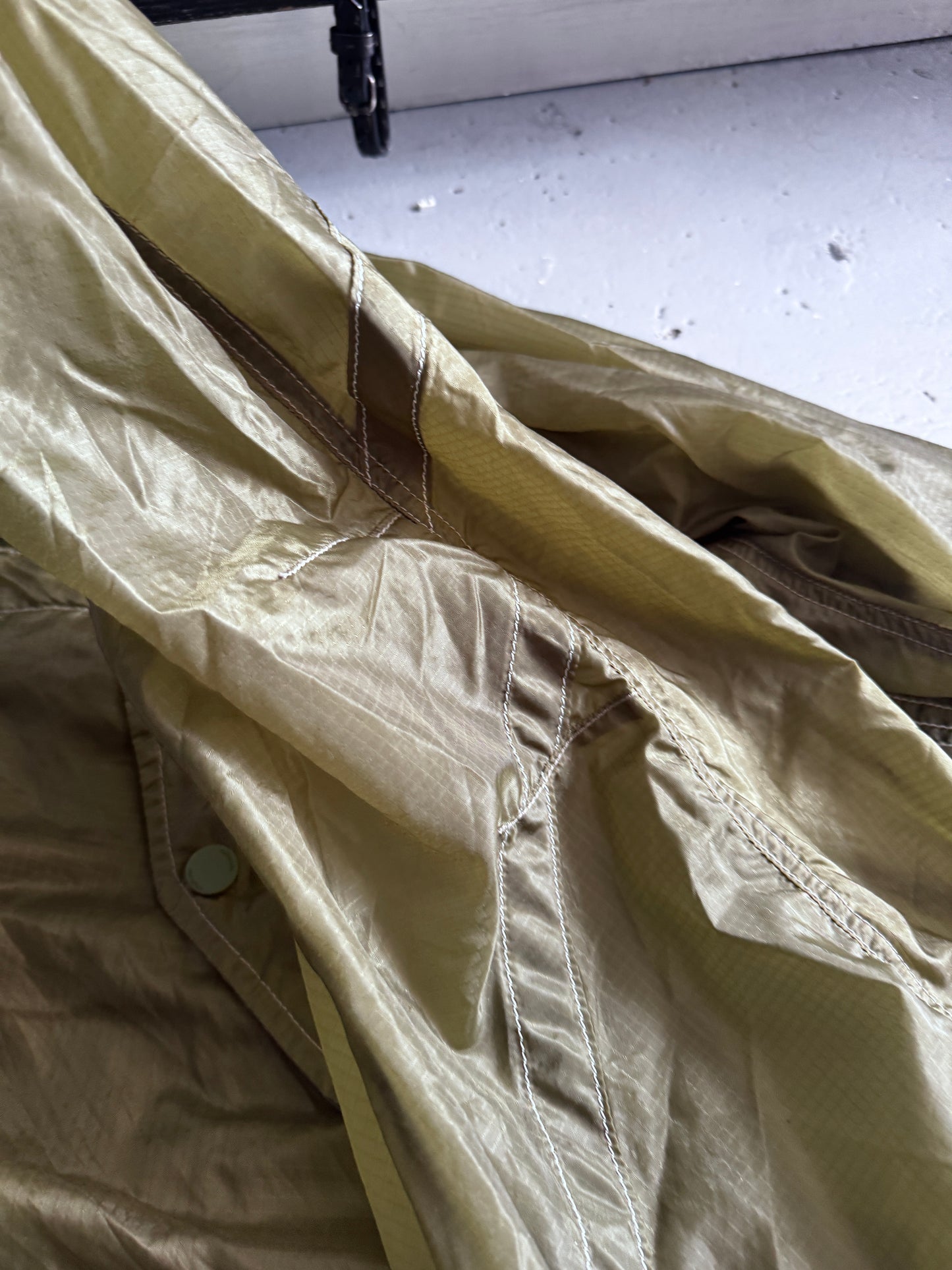 maharishi sheer textile cross front parka